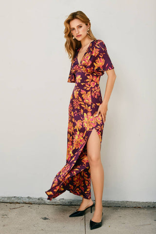 Woman wearing a floral dress with a white background